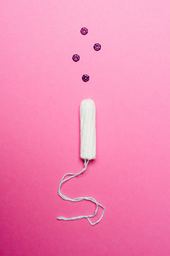 Tampon on pink background