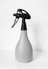 sprayed bottle close up on the white background. Isolated.