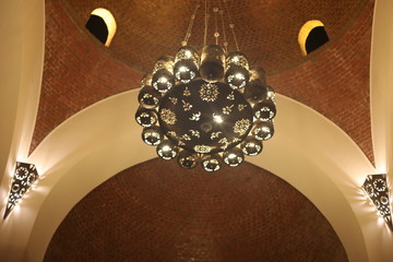 bronze chandelier in a medieval room
