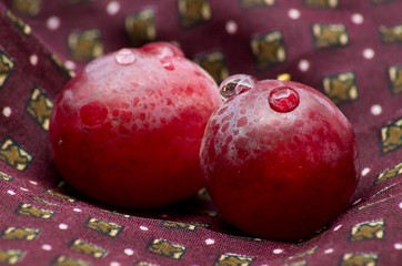 Shot to some grapes on a piece of bordeaux cloth