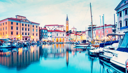 Beautiful amazing city scenery on the waterfront with boats in Piran, the tourist center of...