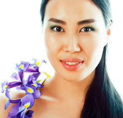 Fototapeta premium young pretty asian woman with flower purple orchid close up isolated spa, womans day concept