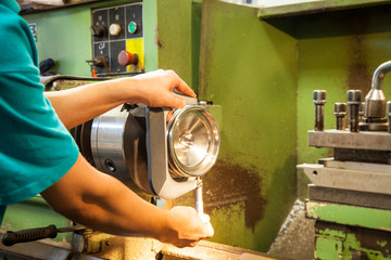 Technician Measuring Steel Bar on CNC Machine