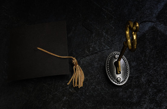 Gold key and grad cap