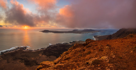 a beautiful panoramic view of the island of La Graciosa from the viewpoint Mirador del Rio at sunset