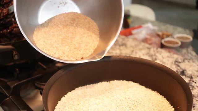 Top view. Sesame Seeds in the pot. Preparing Mole from Puebla, Mexico. North America. Cooking Traditional recipe