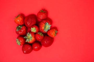 Strawberries on red background