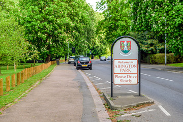 abington park entrance sign between footpath and road in northampton england uk