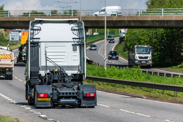tractor unit lorry truck on uk motorway in fast motion