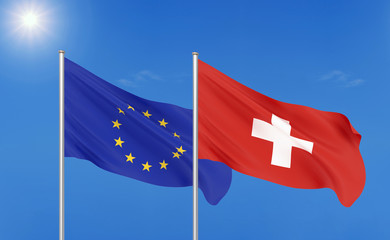 European Union vs Switzerland. Thick colored silky flags of European Union and Switzerland. 3D illustration on sky background. - Illustration