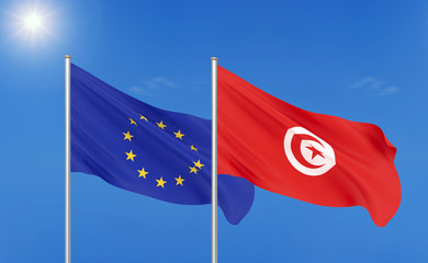 European Union vs Tunisia. Thick colored silky flags of European Union and Tunisia. 3D illustration on sky background. - Illustration