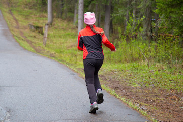 Girl running in the Park.