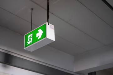 Emergency Fire exit sign at the corridor in building