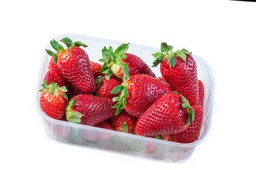 Strawberry in plastic transparent container box, isolated on white