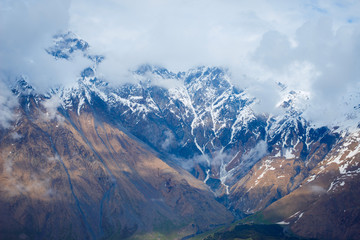 Obraz premium amazing view of the mountain peaks in the clouds