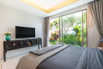 interior design in bedroom of pool villa with cozy king bed