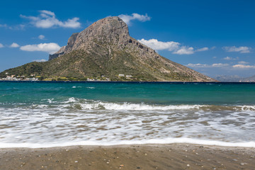 Obraz premium Telendos island, with sea waves in front. Spring view on Kalumnos island. GRECE