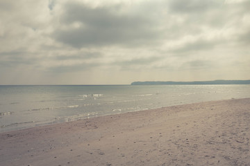 sea ​​landscape in the rays of the sun coming out from behind the clouds