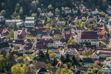 Little village in the middle of the german countryside with a church and half-timber houses and green trees