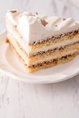 Tiramisu cake slice with white frosting