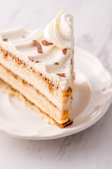 Tiramisu cake slice with white frosting