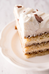 Tiramisu cake slice with white frosting