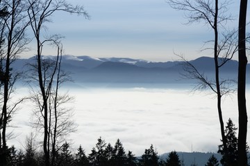 Fototapeta na wymiar Clouds inversion in the town during autumn morning from mountains. Slovakia