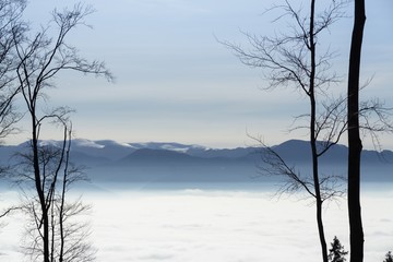 Clouds inversion in the town during autumn morning from mountains. Slovakia