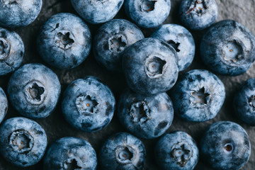 Fresh blueberry background. Texture blueberry berries close up. Vegan and vegetarian concept.