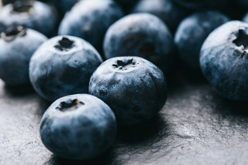 Fresh blueberry background. Texture blueberry berries close up. Vegan and vegetarian concept.