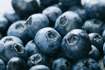 Fresh blueberry background. Texture blueberry berries close up. Vegan and vegetarian concept.