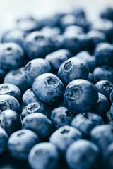 Fresh blueberry background. Texture blueberry berries close up. Vegan and vegetarian concept.