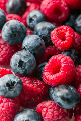 Fresh Summer Berries mix Background with Strawberry, Raspberry, Red currant, Blueberry and Blackberry.