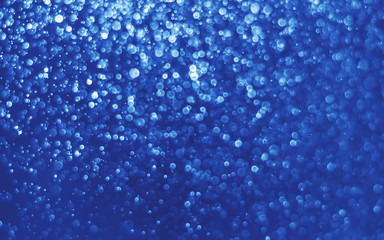 Naklejka na ściany i meble abstract blue bokeh glitter sparkle background.