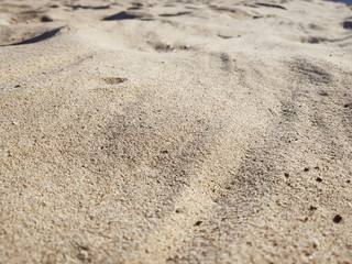 closeup of sand pattern of a beach in the summer