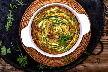 Obraz na płótnie Canvas Spiral Zucchini Tart on wooden table