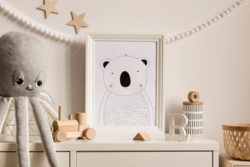 Stylish scandinavian newborn baby shelf with mock up photo frame, rattan basket, plush octopus, wooden toys. Gray garland and white stars.  Modern interior with white walls and children accessories.