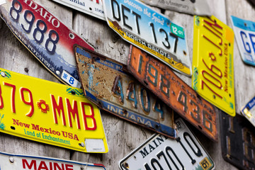 Old USA car plates on the wall