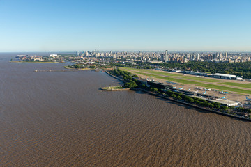 Aerial image showing the full Aeroparque Internacional Ing. Jorge Alejandro Newbery at the river...