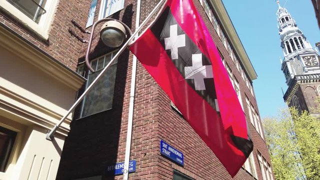 Official flag of Amsterdam with three X symbol in Sint Annendwarsstraat in Red Light District