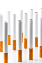 Tobacco smoking. Cigarette close up, isolated on white background.  Bad habit. Nicotine. Drug addiction. Cancer.