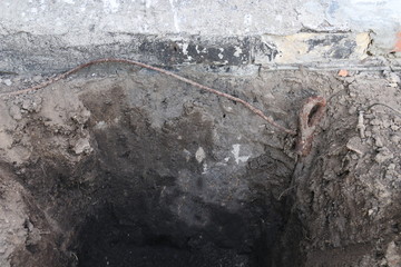 Repair of faulty grounding under the wall of the house