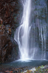 Fototapeta na wymiar Gveleti Big Waterfalls in a Dariali Gorge near the Kazbegi city in the mountains of the Caucasus, Geprgia