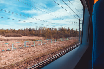 View on landscape from train window. The concept of travel and vacation.