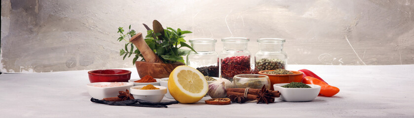 Spices and herbs on table. Food and cuisine ingredients with basil