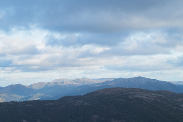 Mountain Ridge with dramatic clouds and skies and sun beams