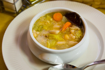Catalan soup of bean with boiled carrots, potatoes and blood sausage