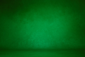 photo background green. textured wall rolling in the floor. studio photography background illuminated by the directed light Traditional painted canvas or muslin fabric cloth studio backdrop - obrazy, fototapety, plakaty