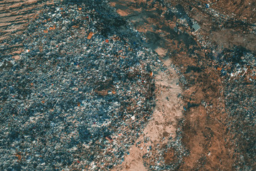 Aerial view of garbage dump. Top view of plastic waste and different trash