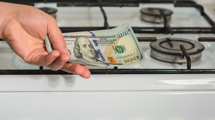 The man holds a bill of lading in his hands in a sign of the rise in price of natural gas near the...
